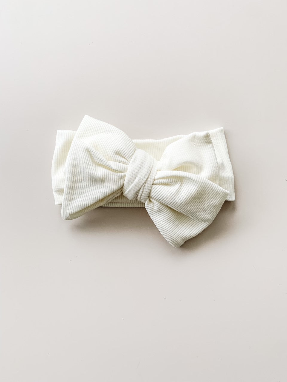 OVERSIZED RIBBED COTTON TOPKNOT BOW HEADBAND - WARM WHITE