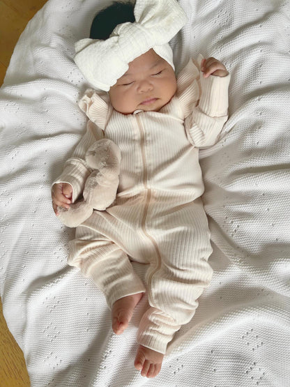 FLUTTER RIBBED ONESIE | SOFT PEACH