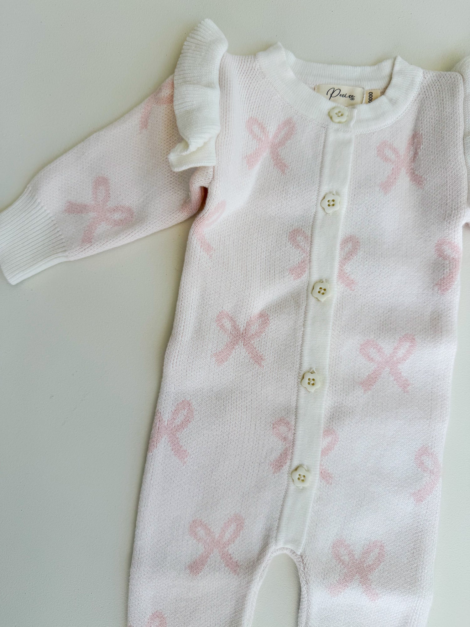 LONG FLUTTER BOW ROMPER | MILK