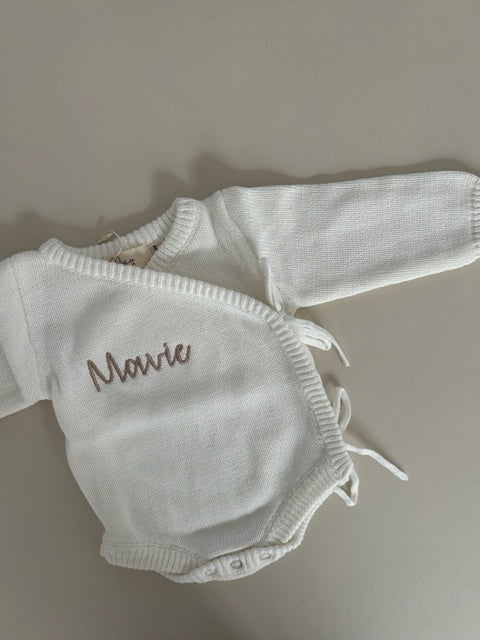 WHITE BODYSUIT, NAME- MAVIE, SIZE 0-3M