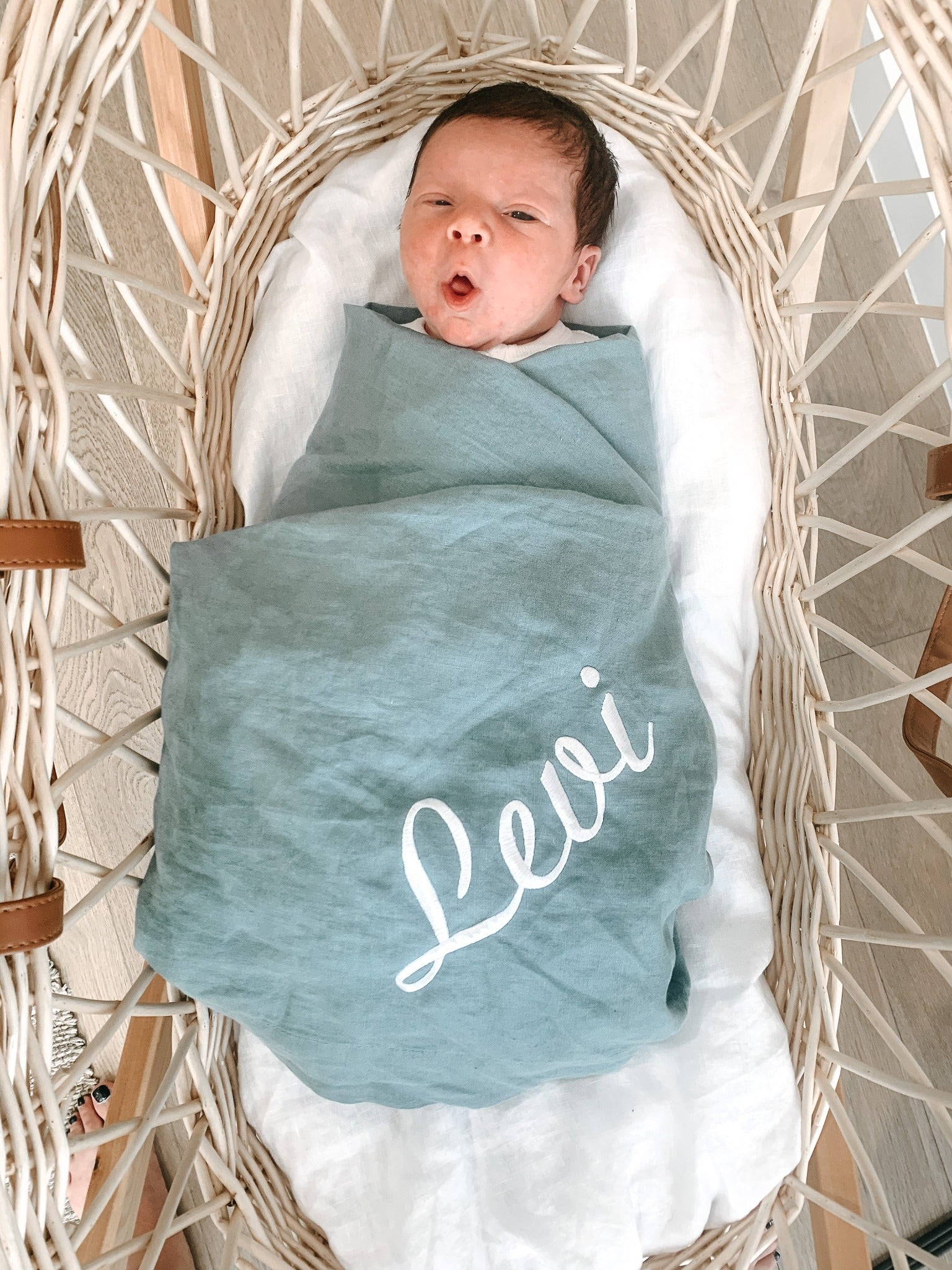 personalized baby linen swaddle blanket in baby basket Australia